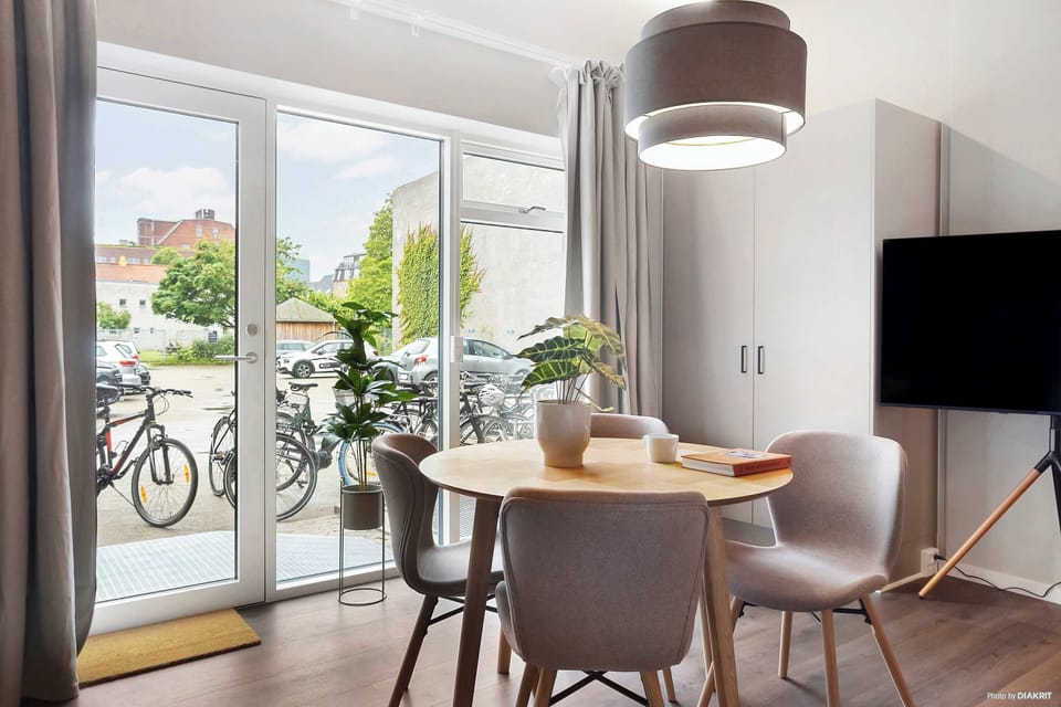 Room view with natural light and both blackout curtains and a thin layer of curtains, to ensure your privacy