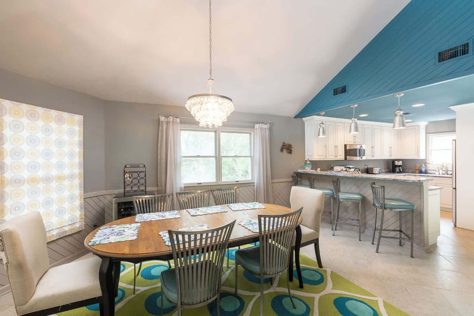 Dining area with open kitchen with breakfast bar