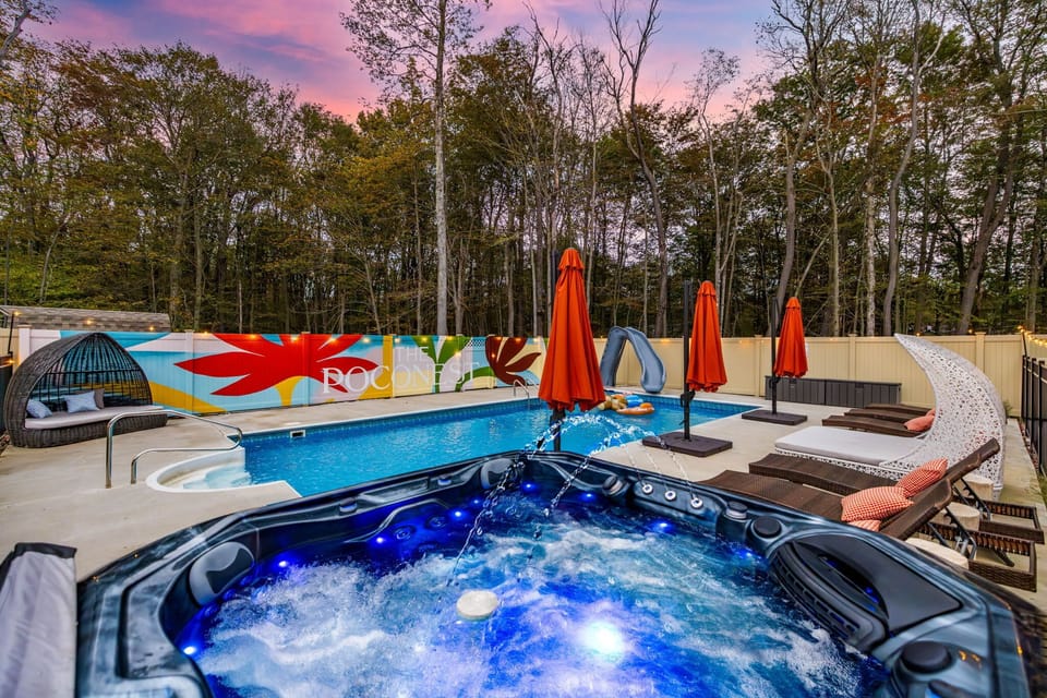 Surrounded by nature, this peaceful poolside oasis features sunbathing lounge chairs, and the joyful sounds of kids splashing and laughing—perfect for lazy afternoons and memory-filled family fun.  Note the slide has been removed due to safety reason
