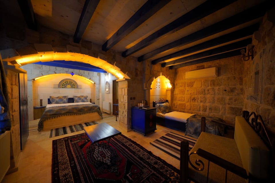 Deluxe Triple Room | Minibar, in-room safe, individually decorated, individually furnished