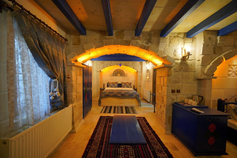 Deluxe Triple Room | Minibar, in-room safe, individually decorated, individually furnished