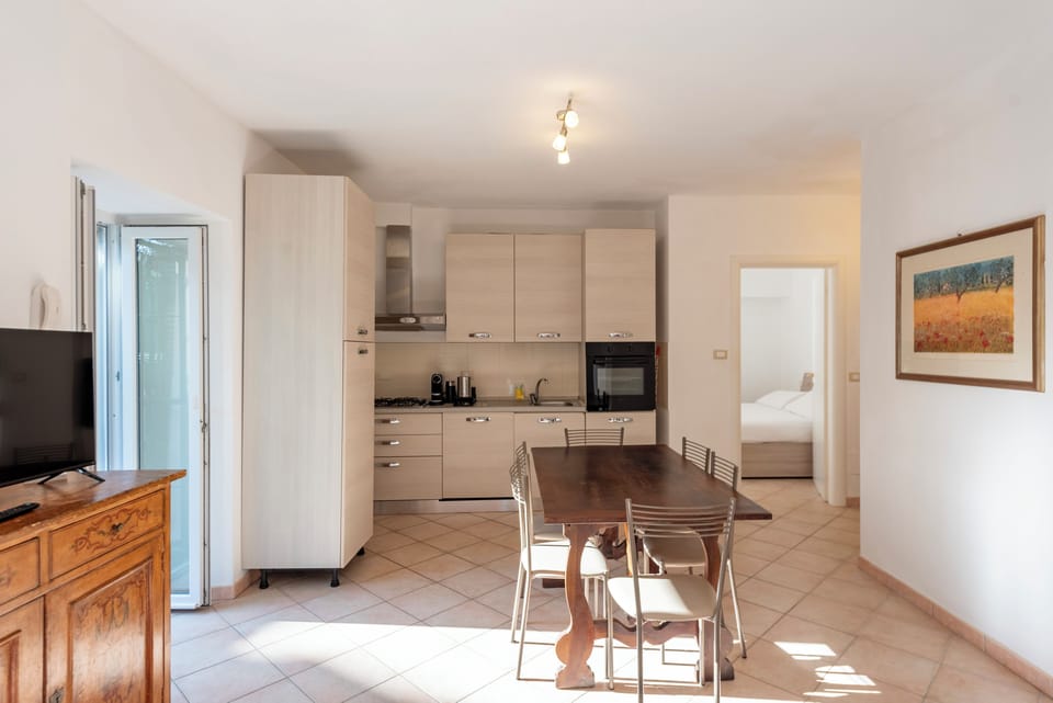 Family Apartment, 1 Bedroom, Garden View | Private kitchen | Dishwasher, electric kettle, dining tables
