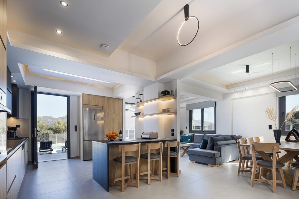 The living room & kitchen area opens to the pool terrace. 