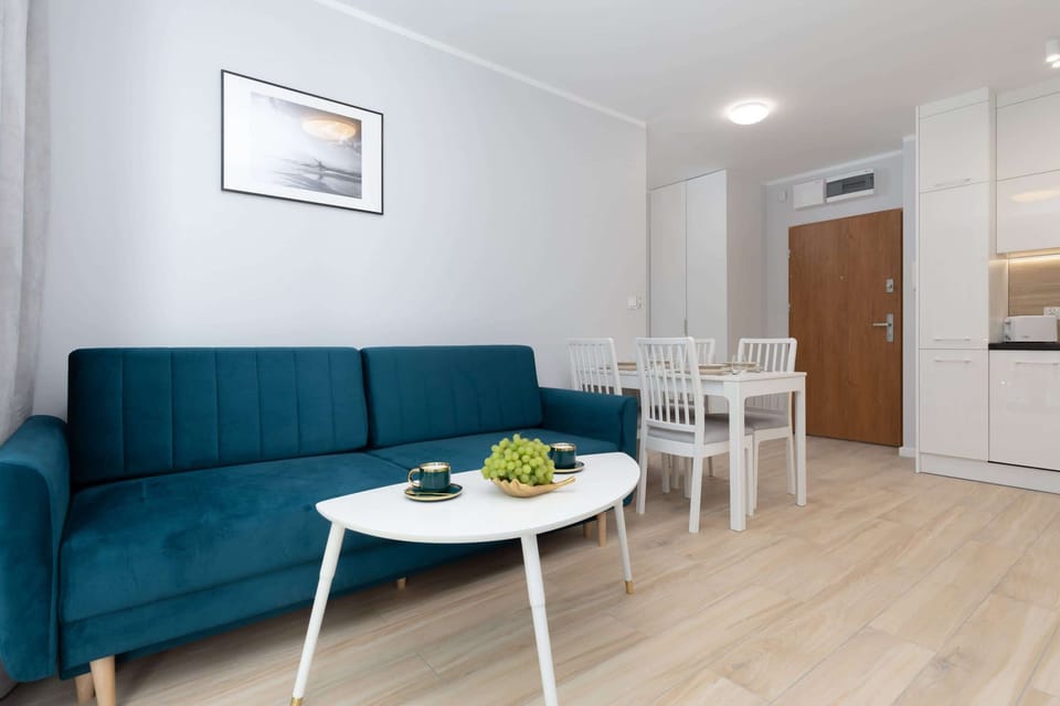 The elegant living room featuring a double sofa bed.