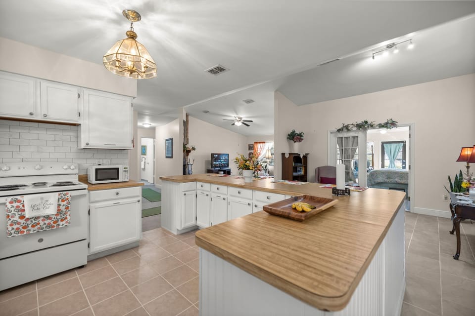 Bright kitchen counter and prep area designed for easy meals and entertaining.