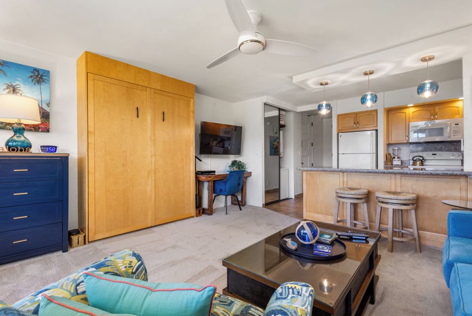 Relax in your open-concept retreat with comfy seating, Murphy bed, kitchenette at the breakfast bar, and cool coastal vibes throughout. Everything you need to feel right at home.