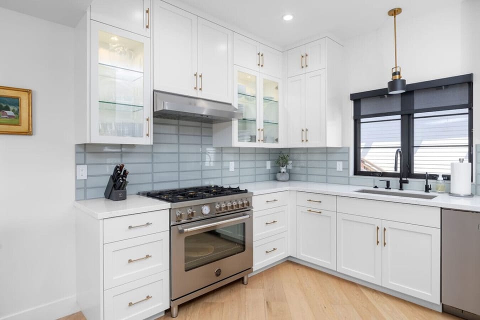 Gourmet chef’s kitchen with gas range and stainless appliances