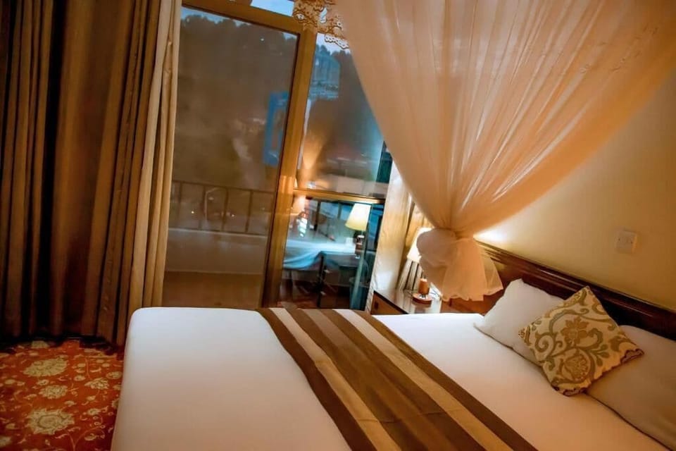 Deluxe Double Room, Balcony, City View | Desk, laptop workspace, iron/ironing board, WiFi (free)