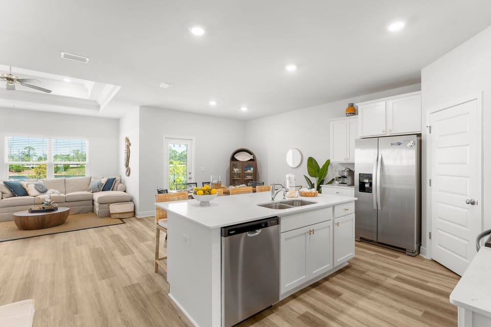 Your bright, modern kitchen flows seamlessly into the cozy living area, creating the perfect space for cooking and relaxing together.