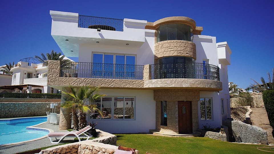 The front of Villa Sharm with a wrap around balcony.