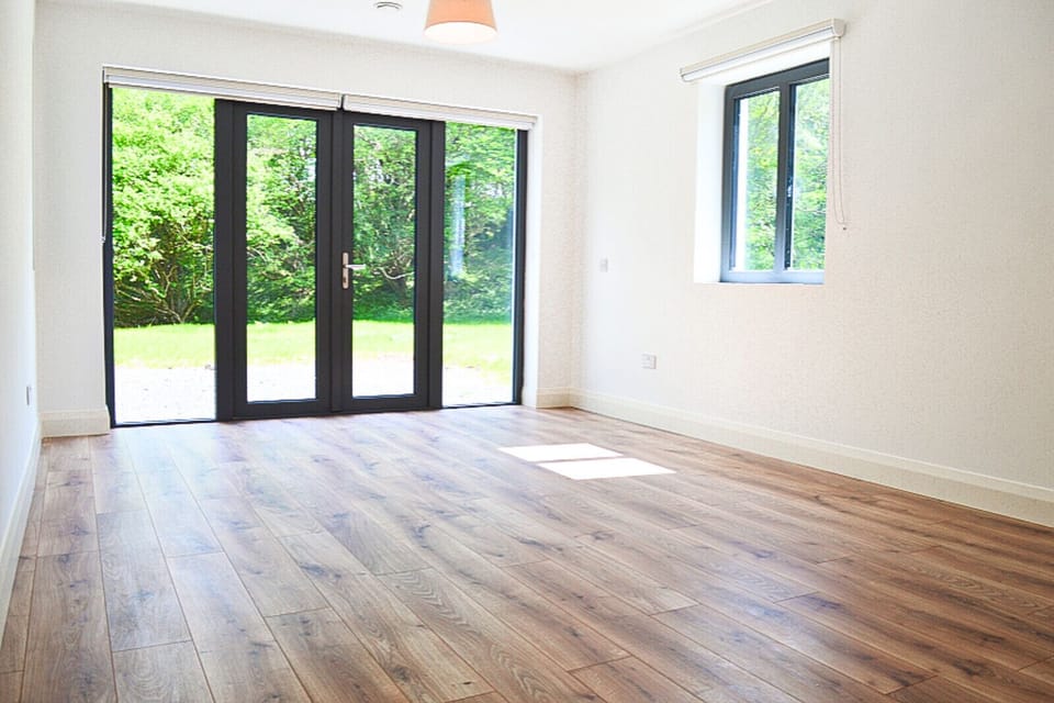 Lough Conn Haven Holiday Home. Bright modern spare room wooden floors.