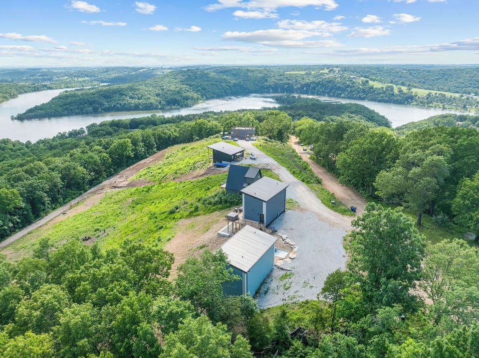 Soar above your next getaway! These scenic modern lodges sit high above Forest Lake with breathtaking views of Table Rock Lake and the Ozark Mountains. Just minutes from Silver Dollar City, this Branson retreat is perfect for nature and adventure lovers.