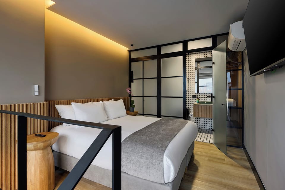 Grand Studio, 1 Queen Bed, Balcony, City View | Down comforters, minibar, in-room safe, blackout drapes