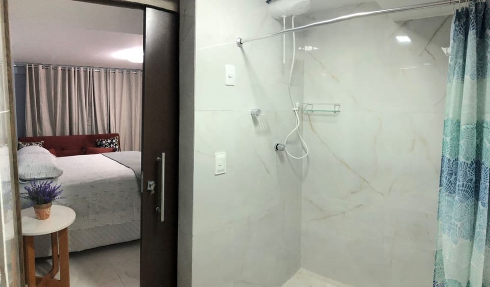Family Quadruple Room, Air conditioning, Pool View | Bathroom | Shower, towels, toilet paper