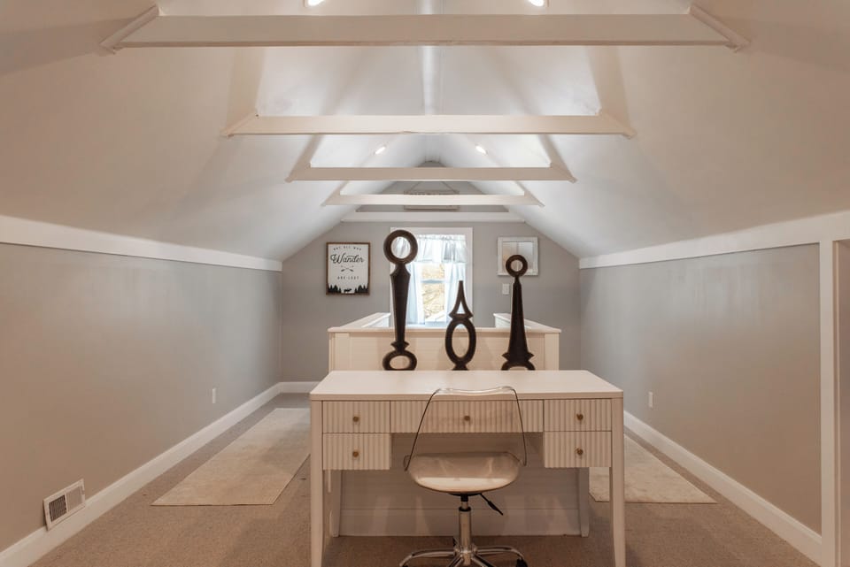 In the loft bedroom there is a small desk and chair for working