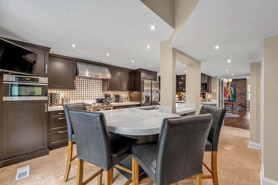 Designed for connection and comfort, the elegant dining area provides the perfect setting for family meals, casual breakfasts, and intimate dinners with friends. It's a place where stories are shared and lasting memories are made.