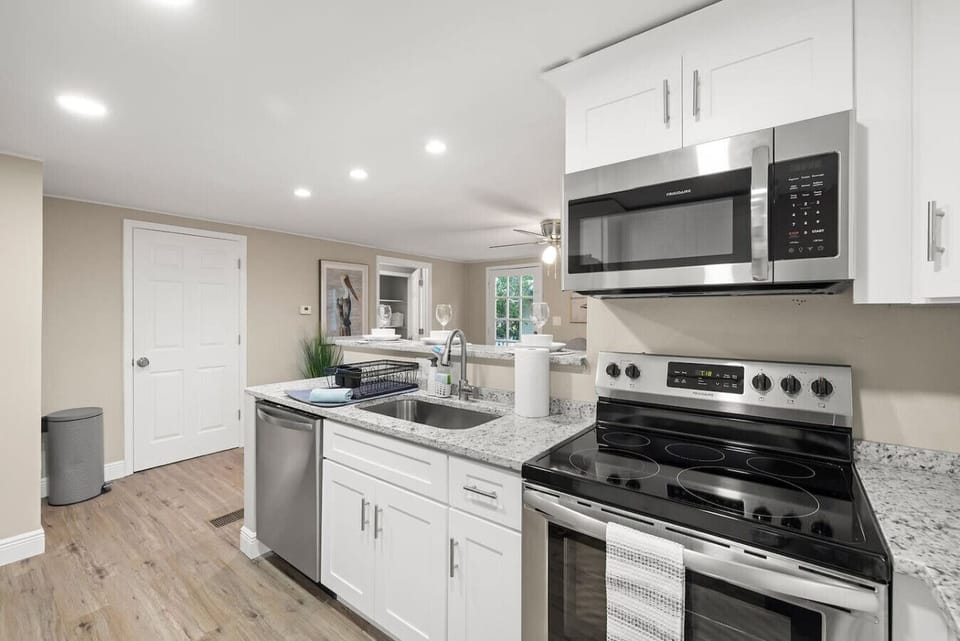 Sleek design meets convenience in this modern kitchen—perfect for a quick snack or a gourmet meal.