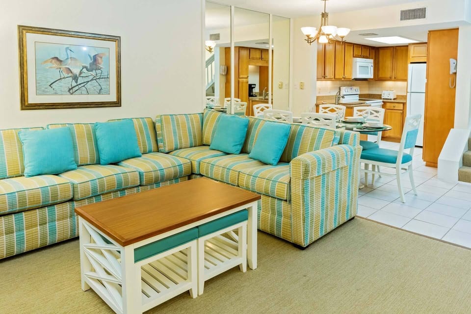 Spacious living room features a queen sleeper sofa.