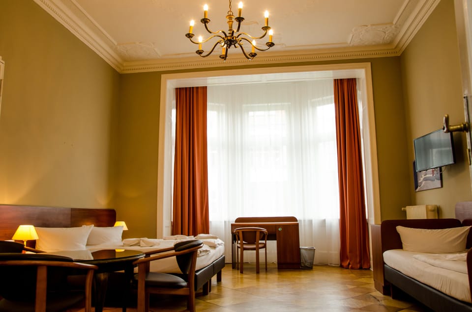 Family Quadruple Room | Hypo-allergenic bedding, desk, laptop workspace, blackout drapes