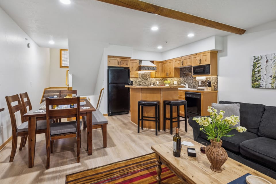 Dining area with natural light, adjacent to the kitchen and living space.