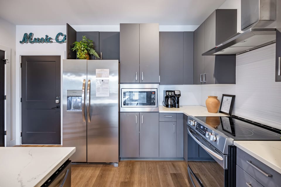 Sleek modern kitchen with stainless steel appliances.