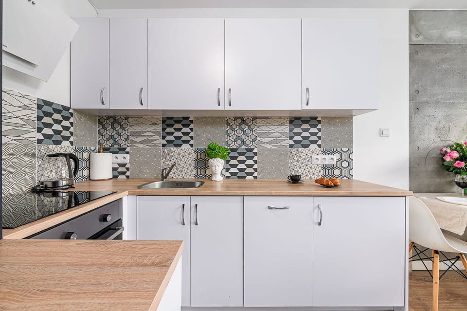 Apartment, Courtyard View | Private kitchen | Stovetop, dishwasher, electric kettle, highchair