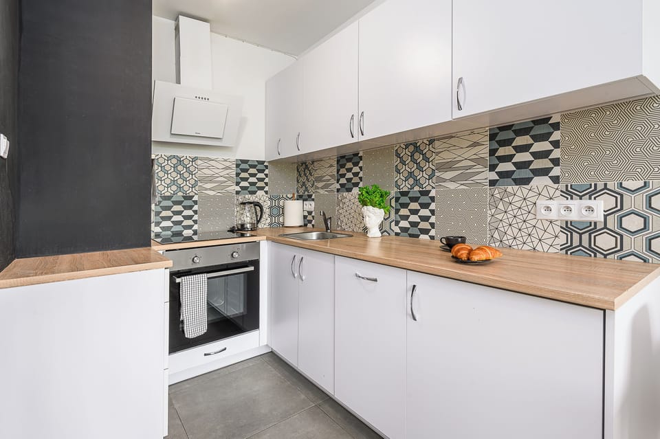 Apartment, Courtyard View | Private kitchen | Stovetop, dishwasher, electric kettle, highchair