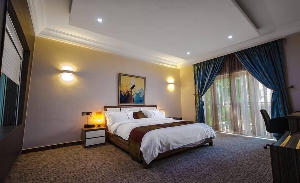 Deluxe Room, Balcony, City View | Desk, laptop workspace, blackout drapes, soundproofing