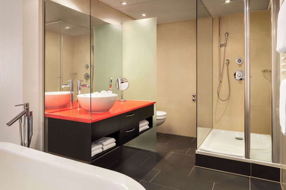 Shower, hair dryer, slippers, towels