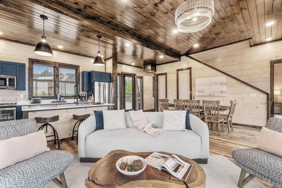 Open main level with kitchen, living, and dining