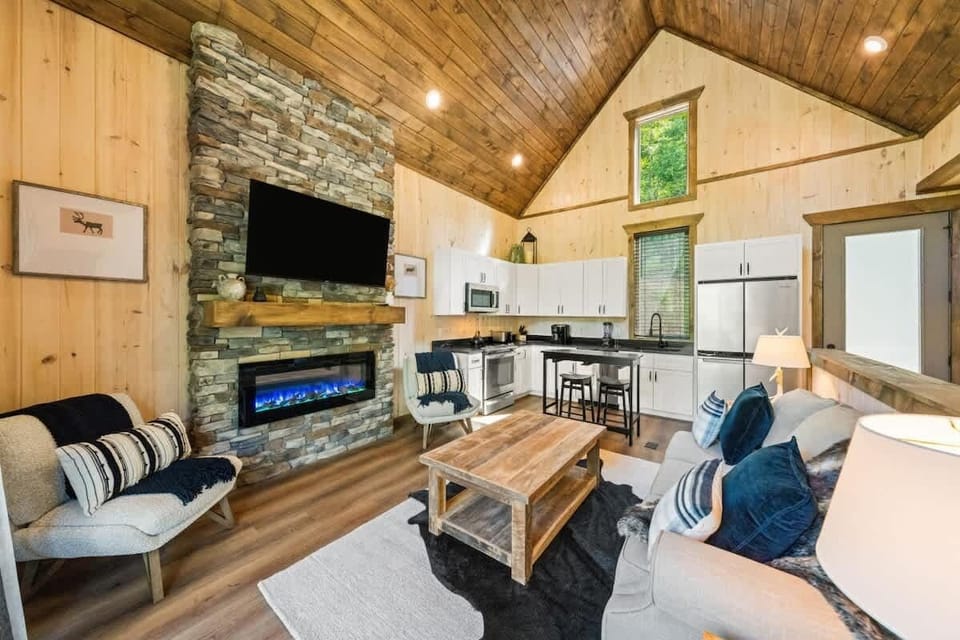 Spacious and open living room with smart TV and electric fireplace