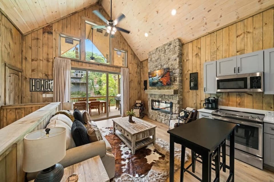 Open main level area with dining, full kitchen, and living room.