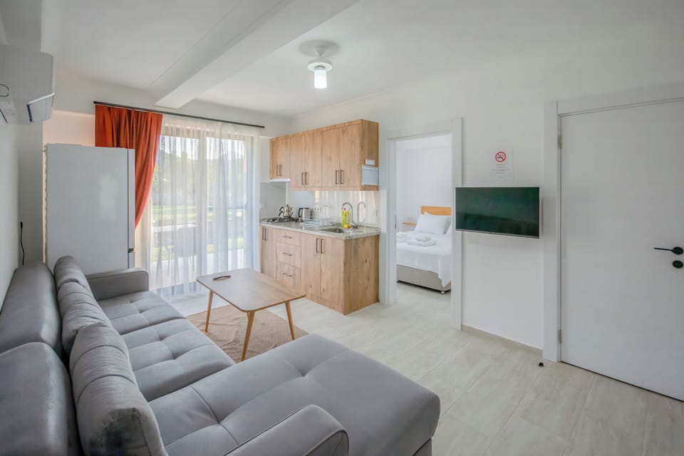Apartment, Garden View | In-room safe, blackout drapes, iron/ironing board, free WiFi