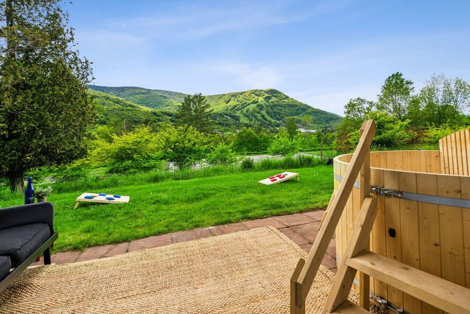 Gather around the fire pit or enjoy a friendly cornhole match. This wide lawn is made for laughter and starlit nights.
