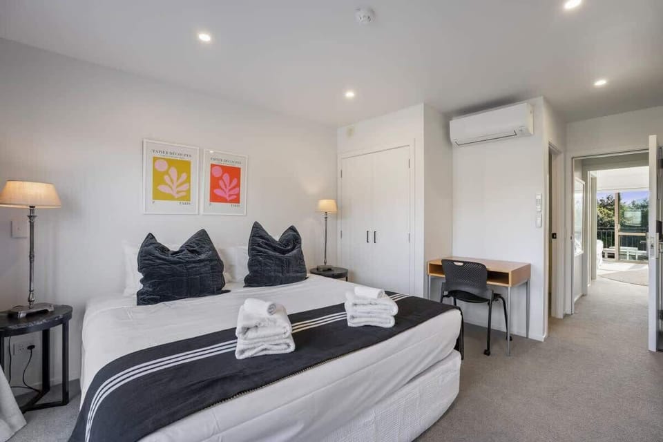 Bedroom with heat pump and desk
