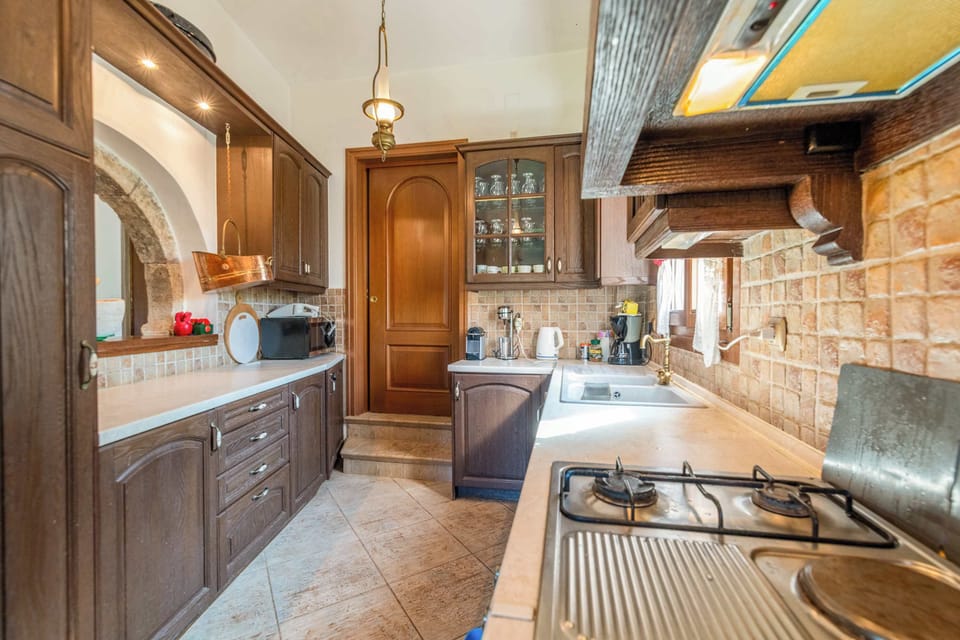 Charming touches and modern convenience meet in the kitchen.
