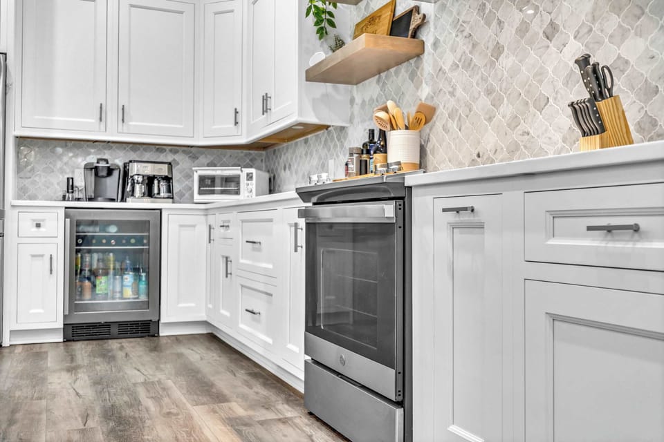 The chic, open kitchen offers ample space & every home comfort