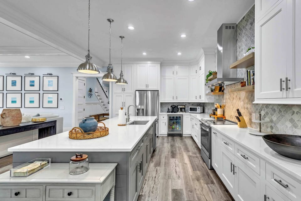 The chic, open kitchen offers ample space & every home comfort
