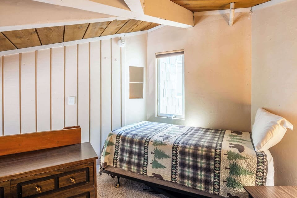 The upper-level loft offers a trio of cozy twin-size beds