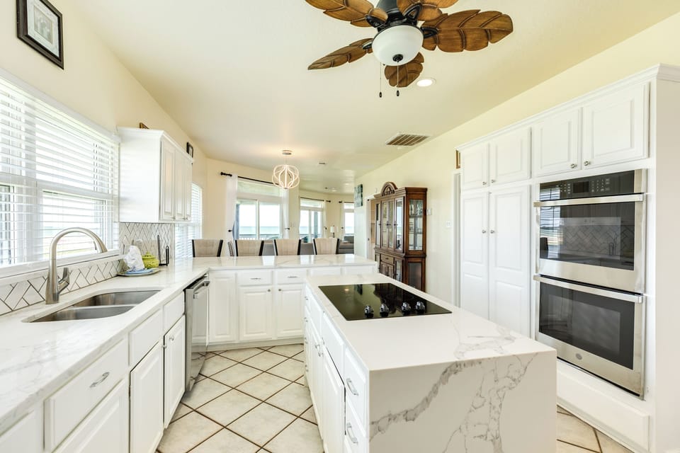 The family cook will love preparing meals with the double oven and island cooktop