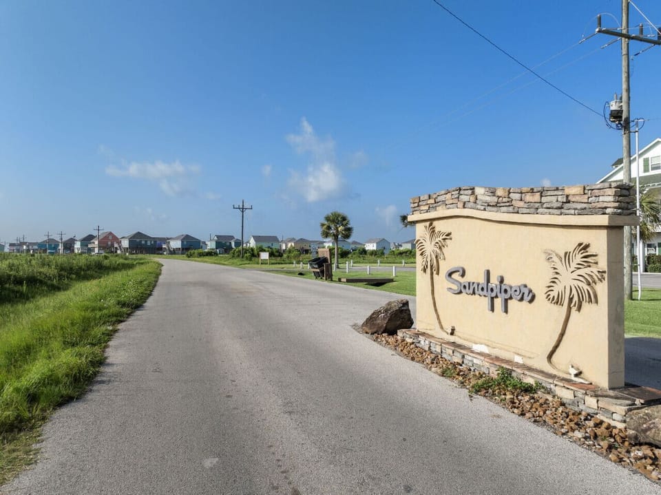 Neighborhood entrance sign near Pickle Beach.