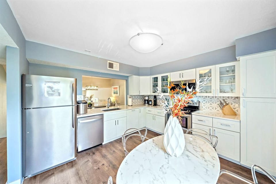 Large kitchen with table and seating for four