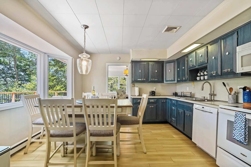 Fully equipped kitchen with blue cabinetry