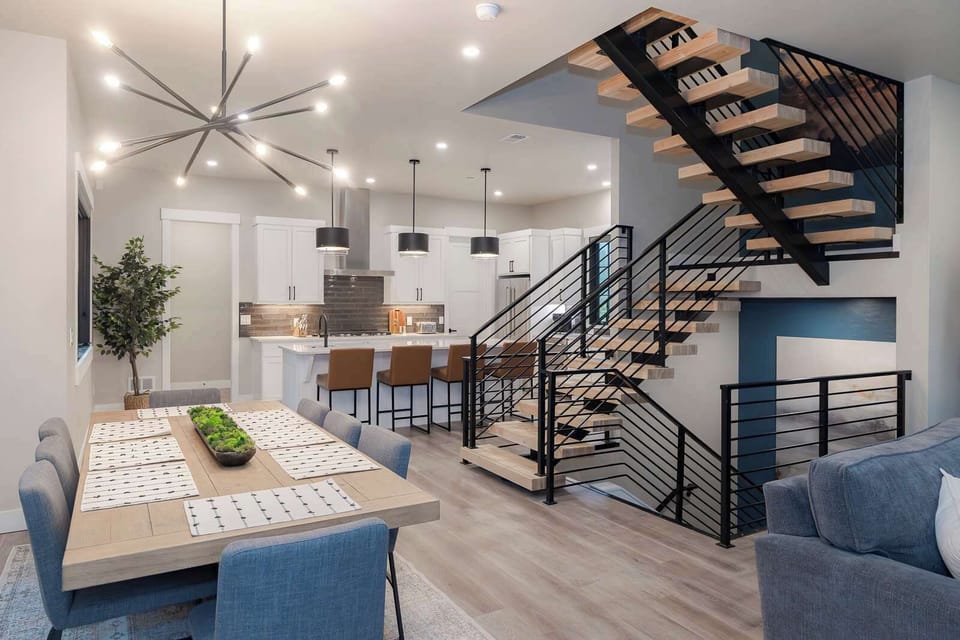 - Step into this stunning home where modern design and comfort flow seamlessly between the kitchen, dining, and living areas. It's an inviting space crafted for connection and memorable moments.