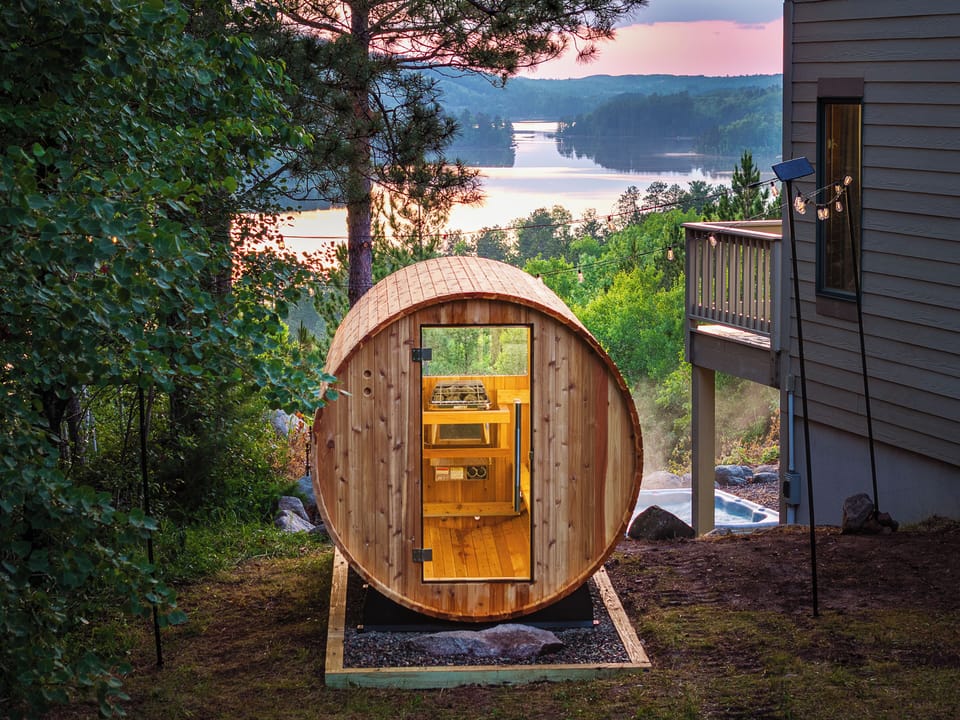 A Sauna & View. Catch a sunset in the 6-person Barrel Sauna overlooking the lake