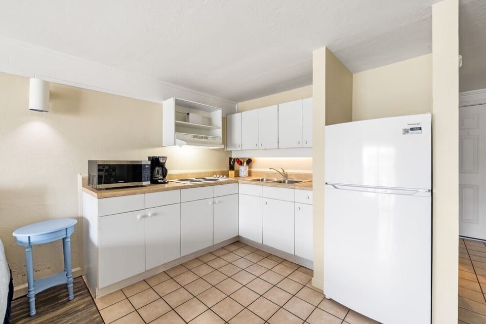 The full kitchen has everything you need for your stay (no oven)