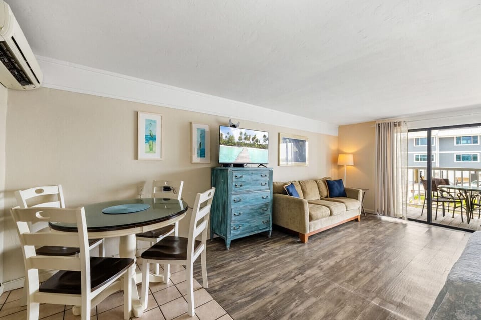 Dining for 4, large smart TV, clothing storage and sofa