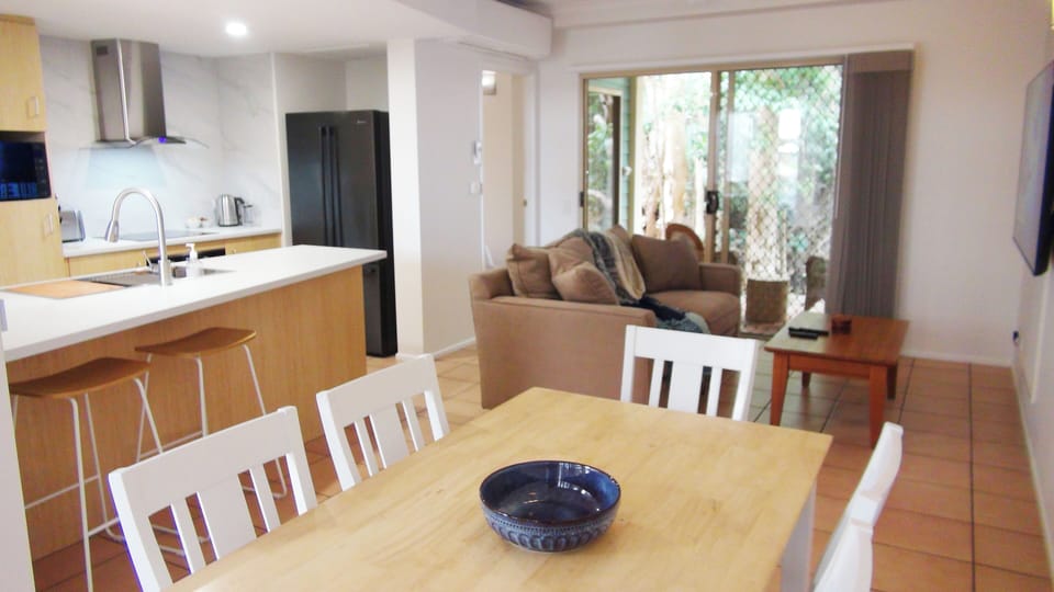 Deluxe Apartment, Non Smoking, Kitchen | Living area | Flat-screen TV