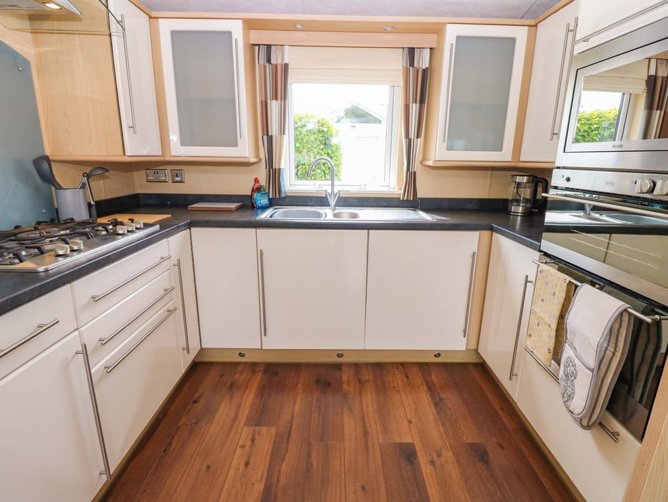 Fridge, microwave, cookware/dishes/utensils