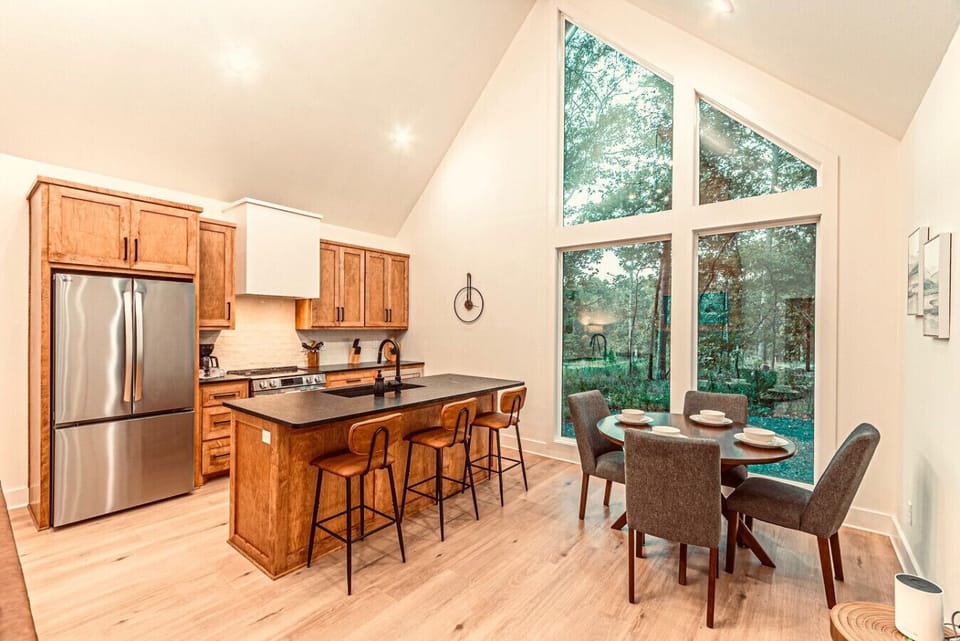 Kitchen: Whip up culinary masterpieces in this bright, modern space with stunning forest views!